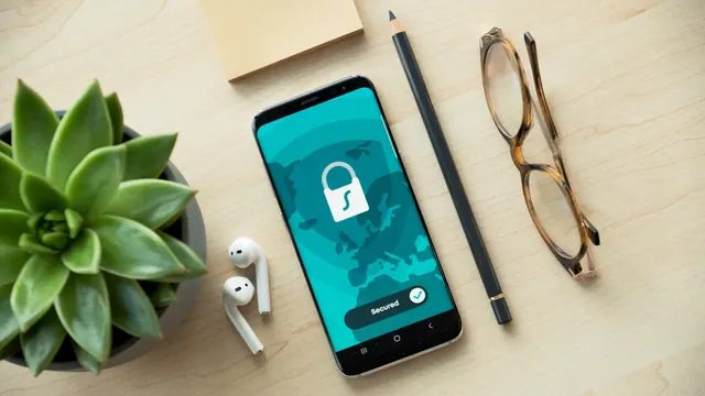 A smartphone displaying a security lock icon on a wooden desk with a succulent Everyday tool composition. Account security case studies: findings and lessons