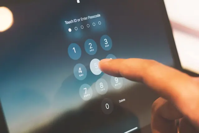 Close-up of a finger entering a passcode on a smartphone security screen. What privacy settings rules involves in practice