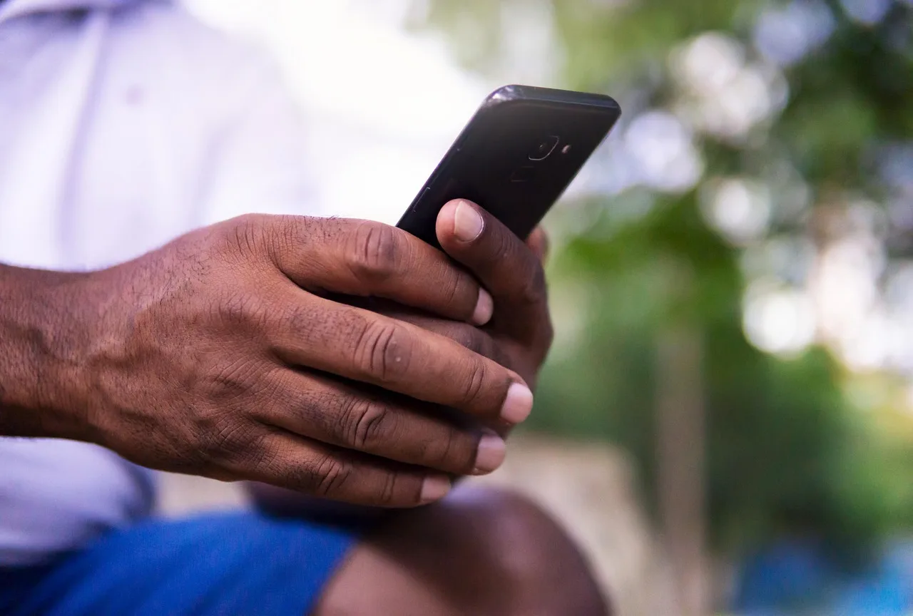 african american, phone, cell, black, hands, holding, view, social media, online, fingers, person, man, portrait, adult, smart phone, internet, browsing, viewing, world, web, outdoors, events. Marketplace scams rules 2027 for household deals