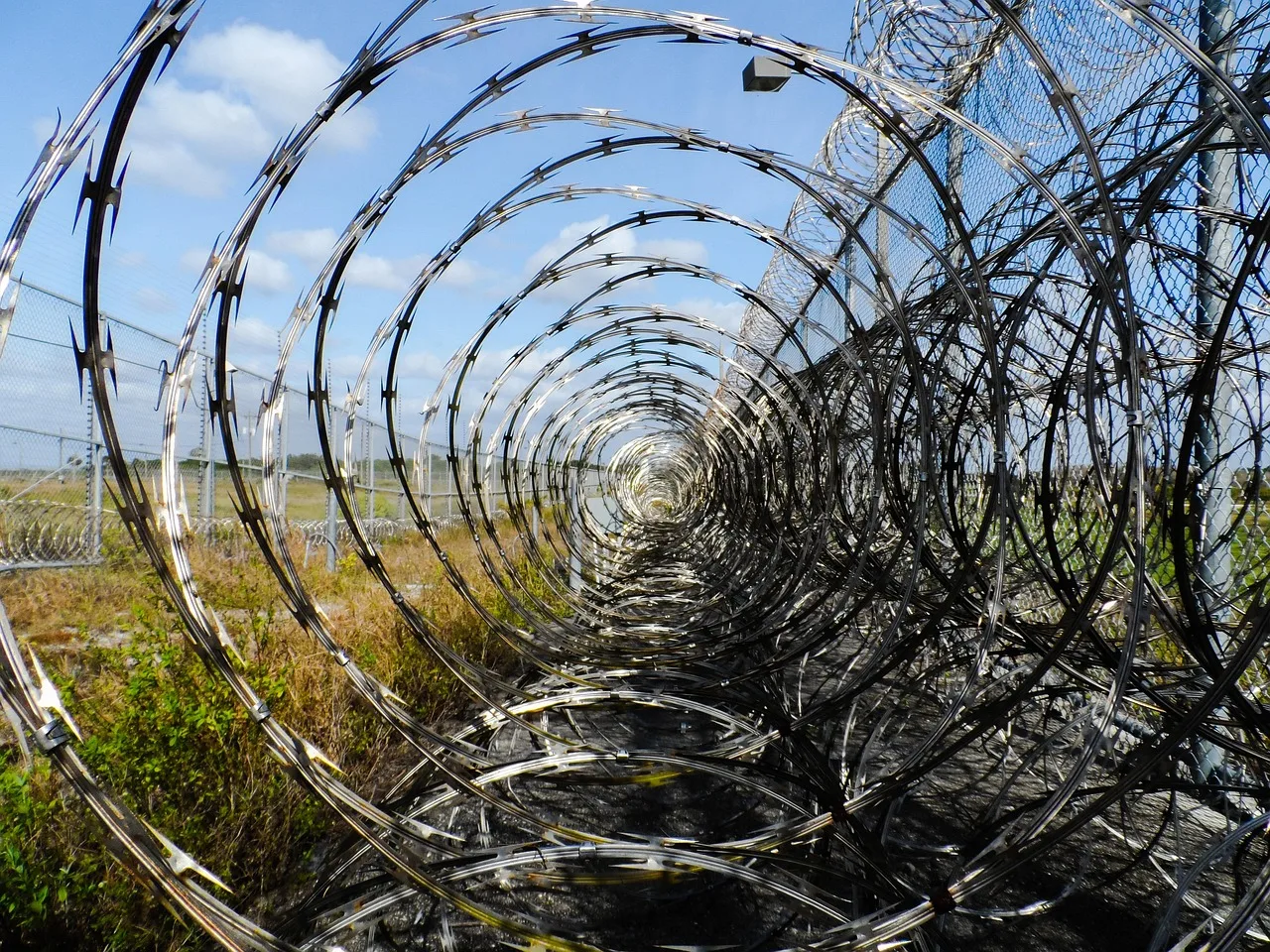 prison fence, razor ribbon, wire, metal, fence, barbed, barb, prison, spikes, barbwire, captive, captured, arrested, prisoner, inmate, detained, jail, protected, immokalee, florida, corrections, correctional institution, justice, law enforcement, police, prison, prison, prison, prison, prison, jail, jail. Romance scams laws 2027: context, not an update