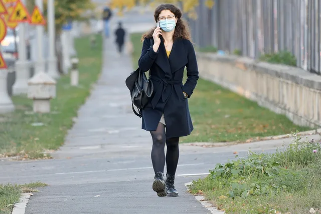 woman, walking, phone call, pandemic, street, sidewalk, talking on the phone, covid. Scam verification: reporting scam calls and texts in Canada